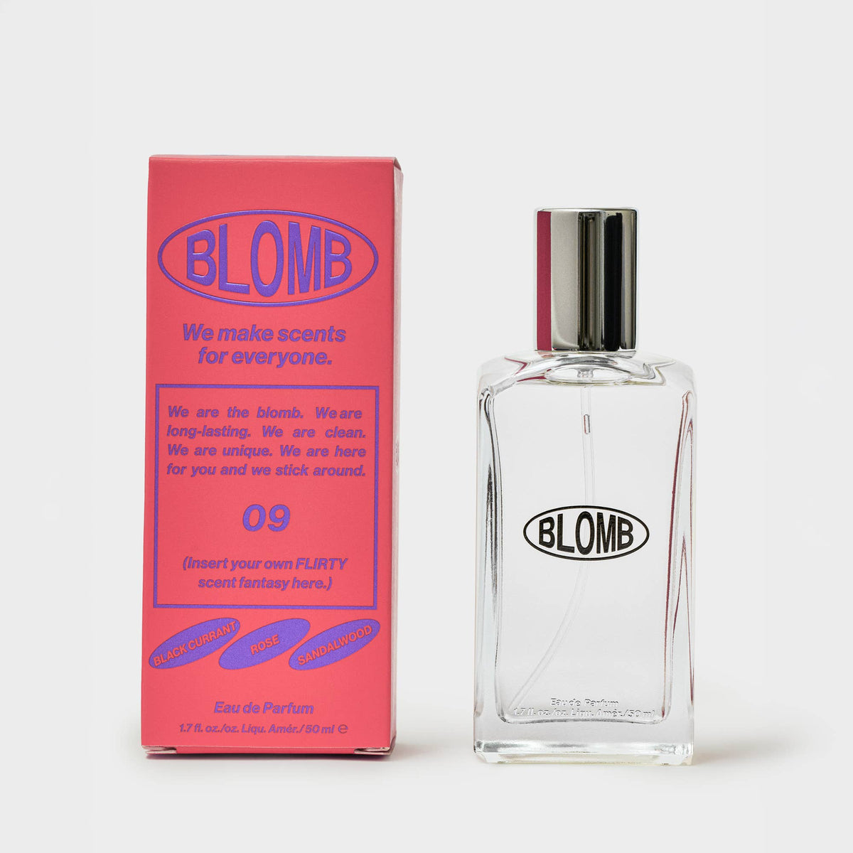 Pink Blomb No. 09 box beside a clear glass Blomb perfume bottle with a silver cap on a gray background