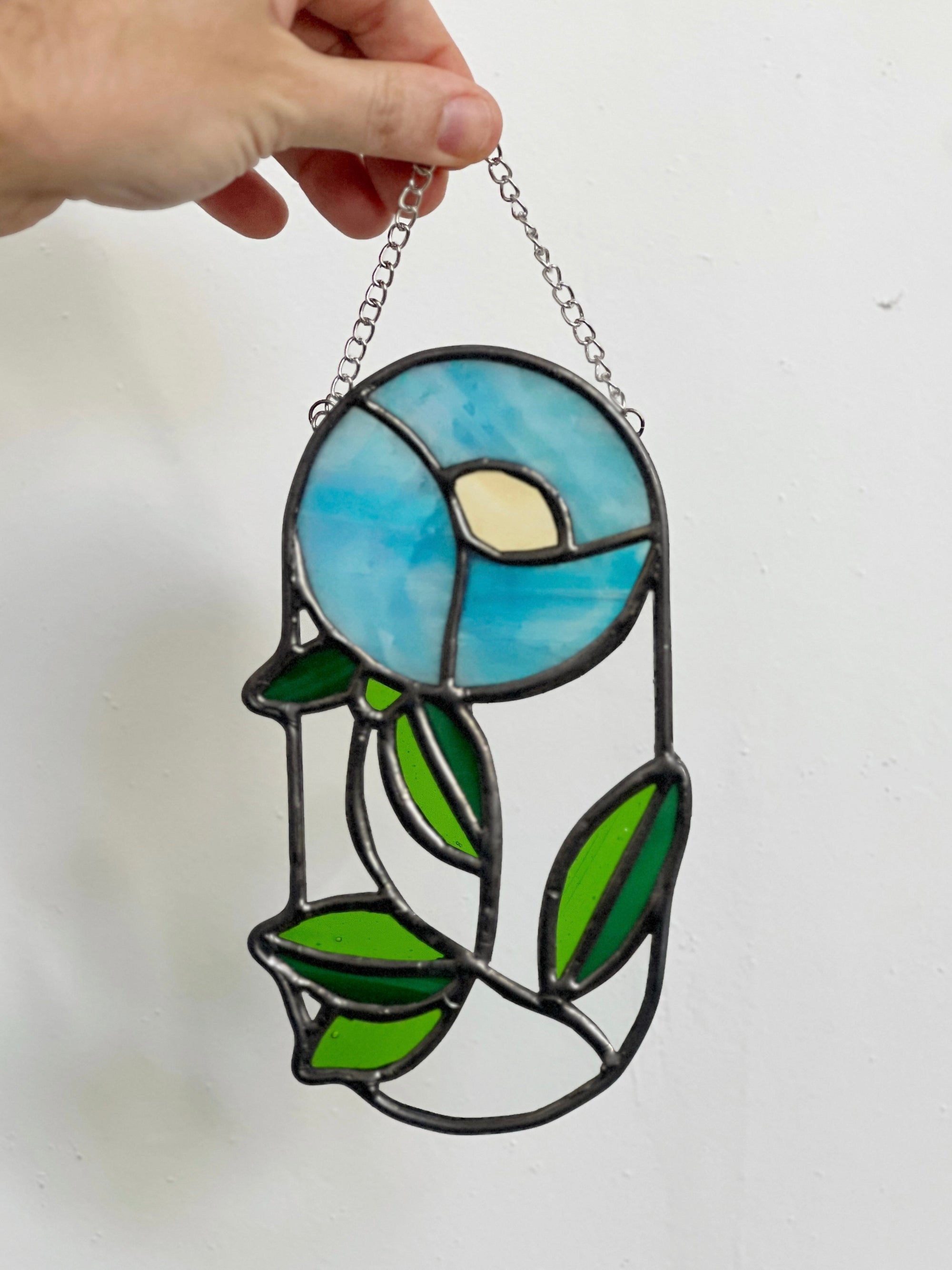 Handcrafted stained glass flower suncatcher. Tulip, blue bud, iris & poppy designs. Floral window decor & nature lover gift for sunny windows.