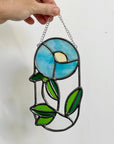 Handcrafted stained glass flower suncatcher. Tulip, blue bud, iris & poppy designs. Floral window decor & nature lover gift for sunny windows.