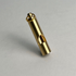 Brass whistle with a keyring loop, standing upright on a light gray background