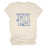 Sand-colored tee with a blue drawing of a goose behind bars and the words Got Too Silly