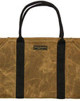 Tan waxed canvas firewood log carrier with webbing handles