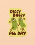 Sticker with two green characters holding hands and text 'Dilly Dally All Day' on a beige background