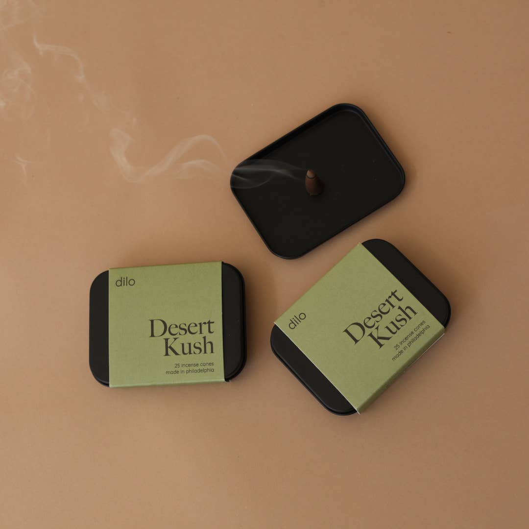 Simply light to fill your space with bright notes of tangerine and cannabis flower that settle into a amber vetiver smoke. Tin contains 25 Incense Cones - Resin + Fragrance Top Notes: tangerine, bergamot Heart Notes: cannabis flower, cypress, moss Base Notes: amber, leather, vetiver