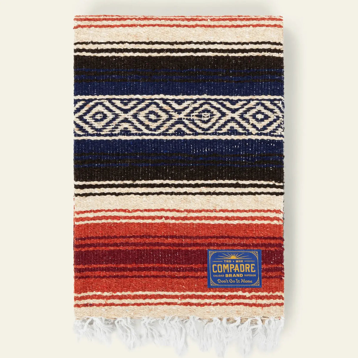 Falsa blanket in navy, black, cream and red stripes with a white diamond band