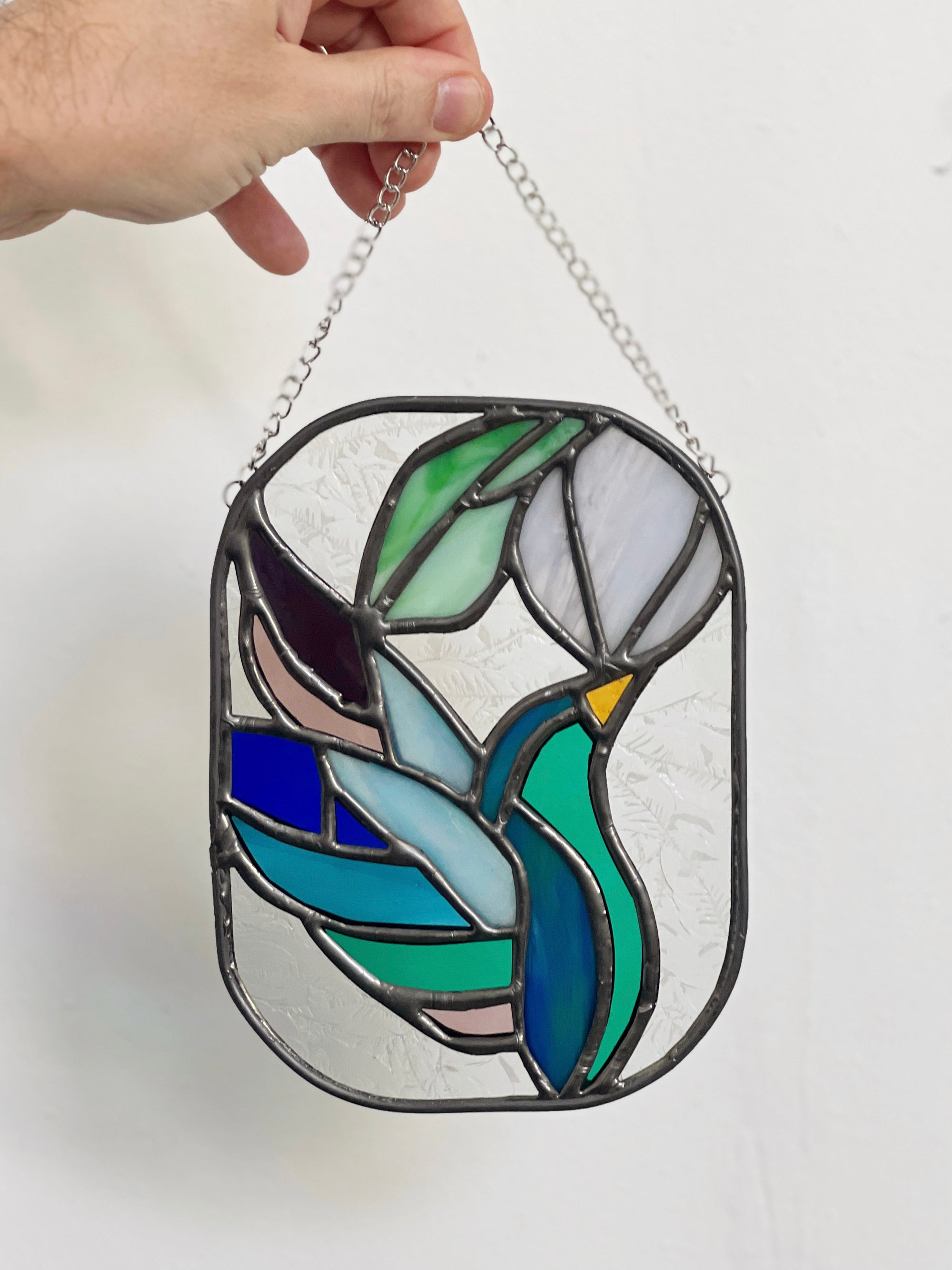 Handcrafted stained glass bird suncatcher. Flamingo, hummingbird & owl designs. Unique window decor & bird lover gift. Perfect for sunny windows.