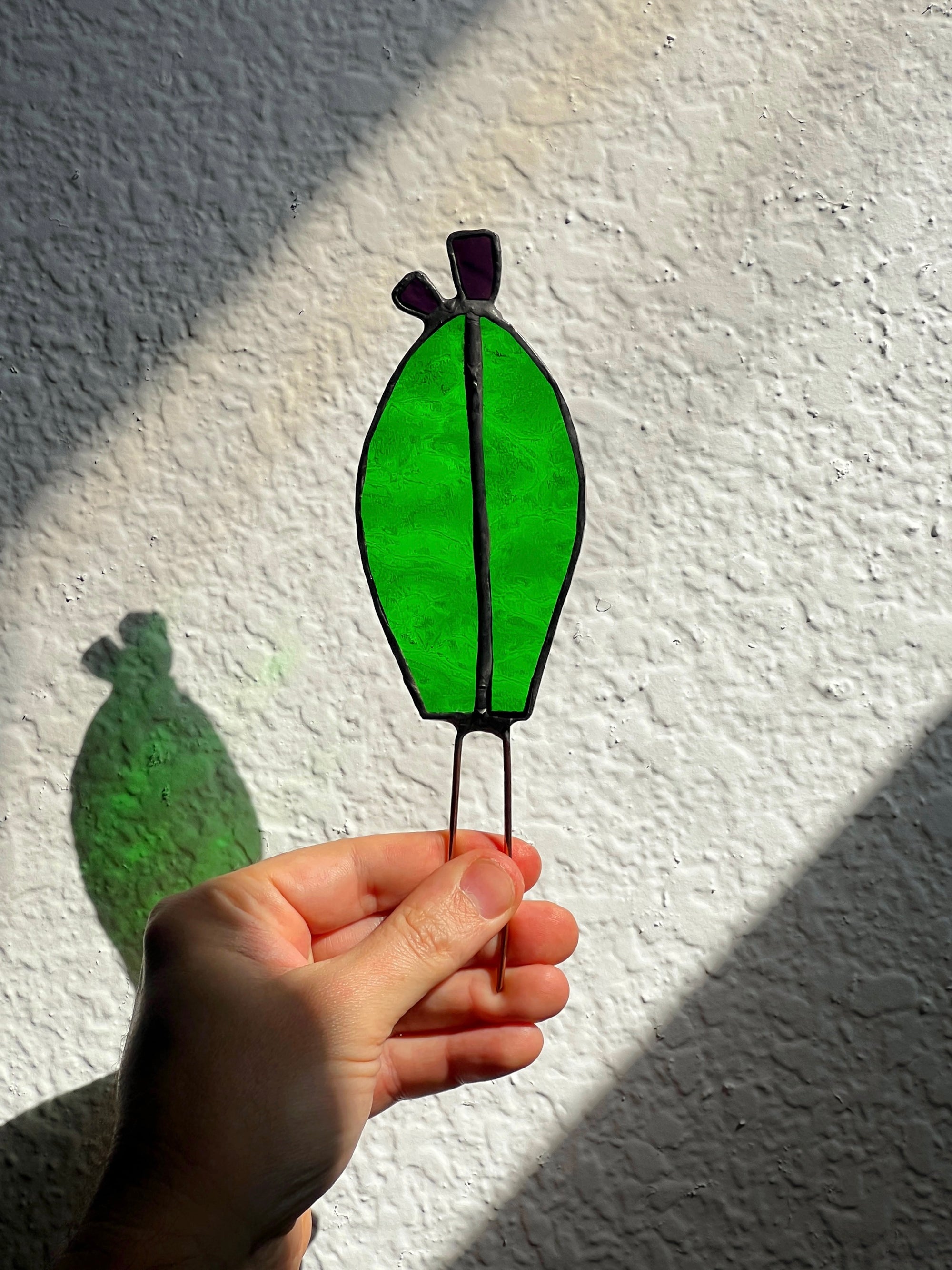 Handcrafted stained glass nopales prickly pear cactus plant stake. Unique boho garden decor & plant lover gift for pots & indoor planters.