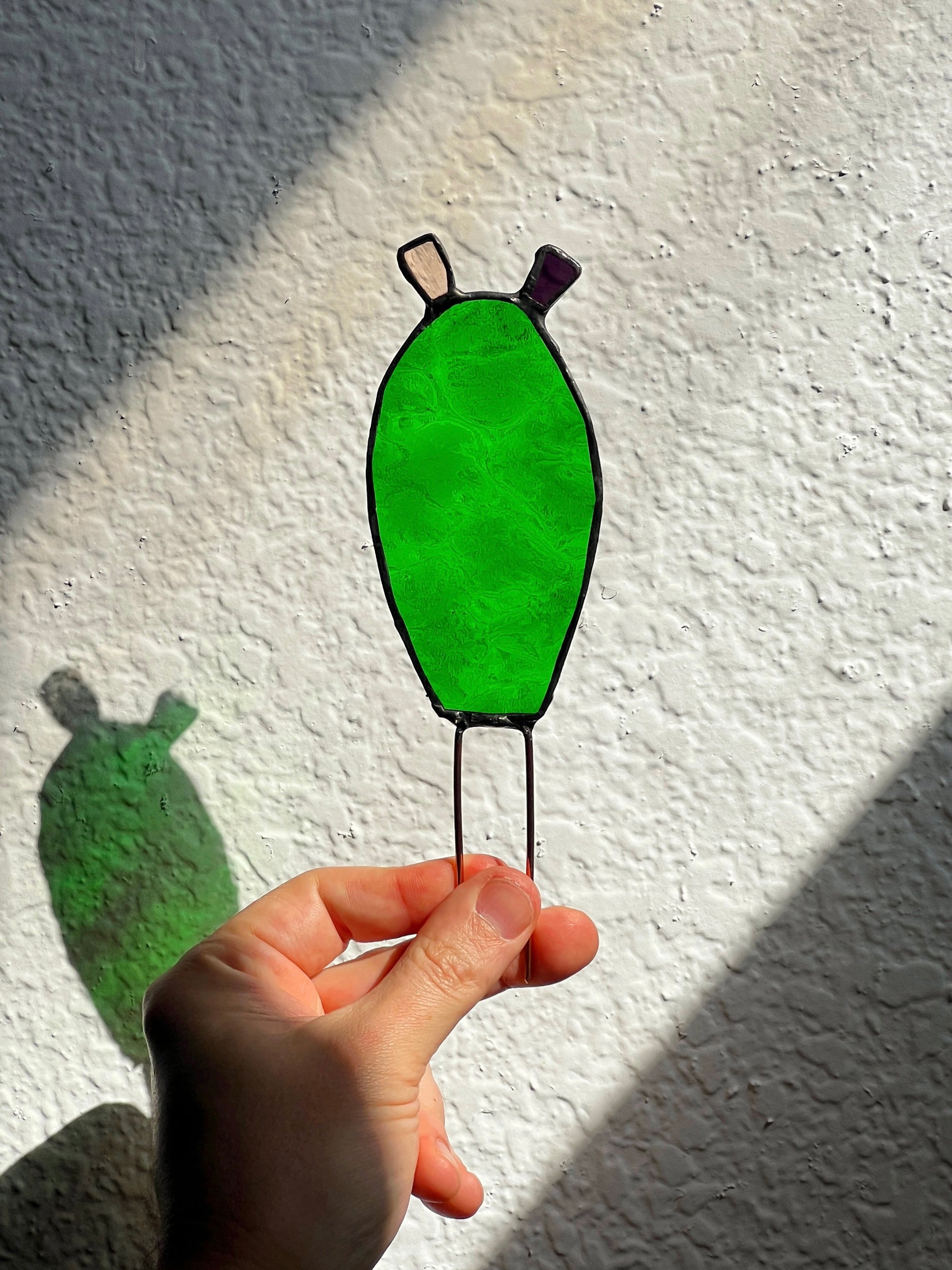 Handcrafted stained glass nopales prickly pear cactus plant stake. Unique boho garden decor & plant lover gift for pots & indoor planters.