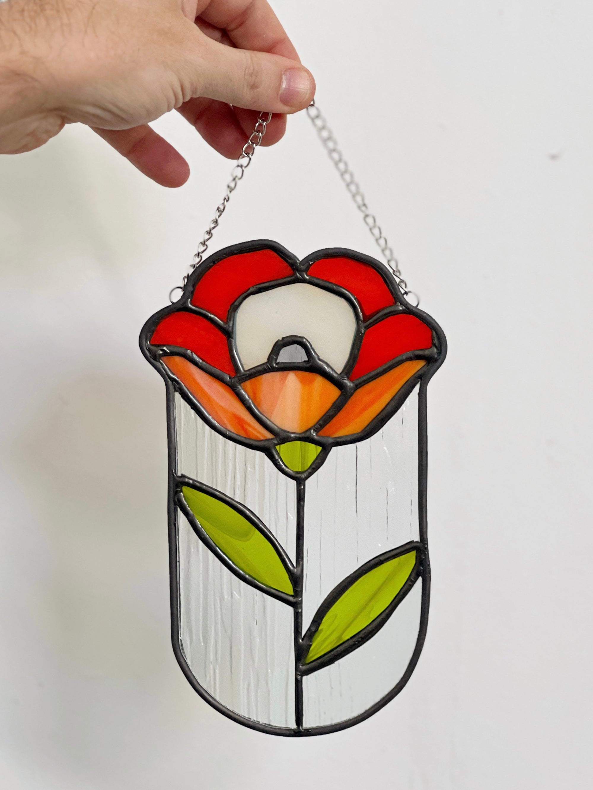 Handcrafted stained glass flower suncatcher. Tulip, blue bud, iris & poppy designs. Floral window decor & nature lover gift for sunny windows.