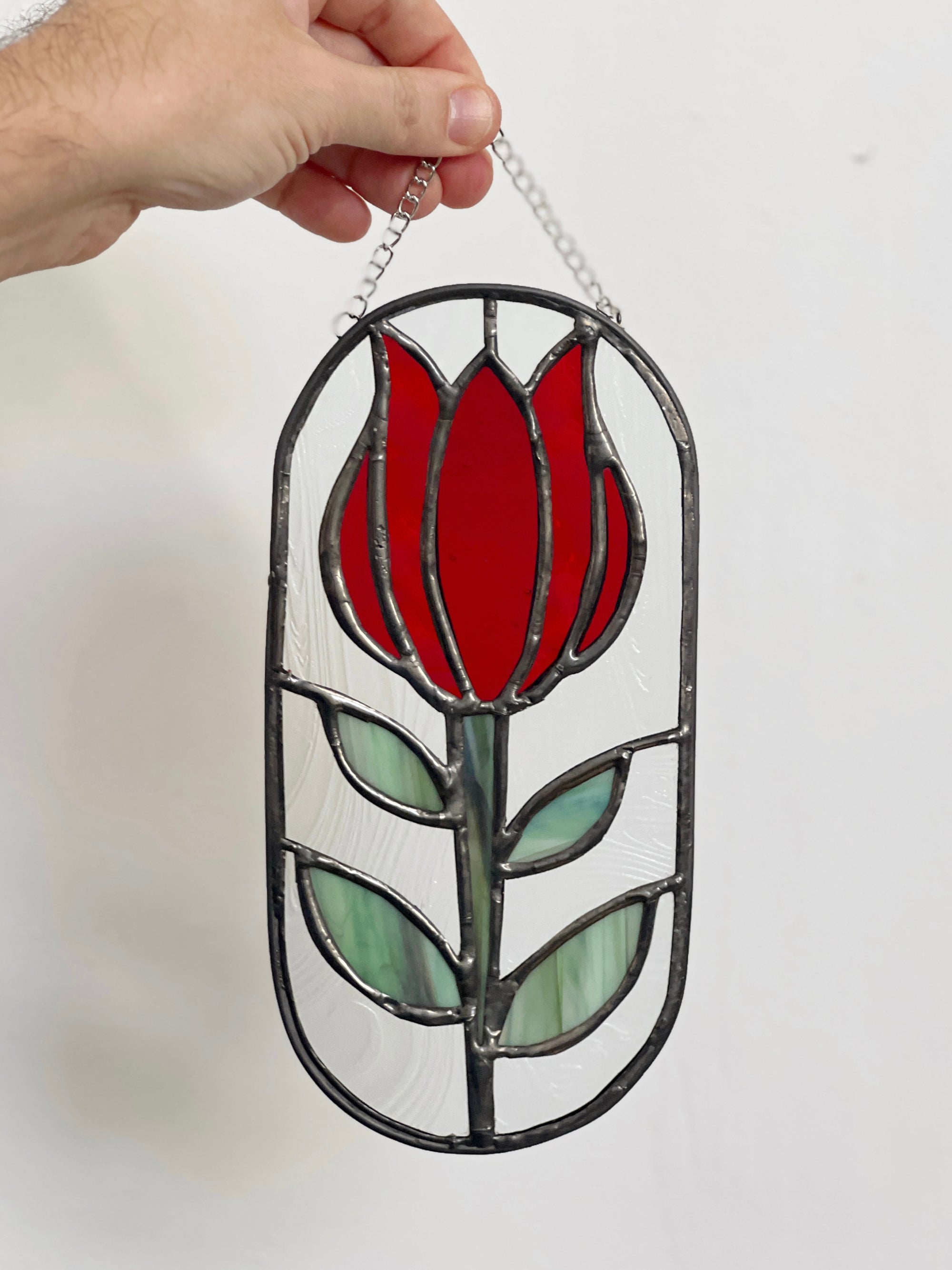Handcrafted stained glass flower suncatcher. Tulip, blue bud, iris & poppy designs. Floral window decor & nature lover gift for sunny windows.