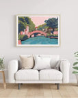 Embark on a visual journey to the heart of San Antonio with this enchanting print, capturing the essence of a leisurely stroll along the iconic River Walk. Offering the best of both worlds, immerse yourself in the charm of shops and restaurants while enjoying the scenic beauty of a riverside promenade. Created by Austin-based artist El Baker, this artwork transforms Texas landscapes into playful masterpieces, ensuring your home is adorned with vibrant colorways that spark joy and bring a touch of San Antoni