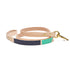 Natural leather dog leash with indigo and aqua painted blocks and a brass clip on white