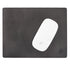 Black leather mat with a white computer mouse on it