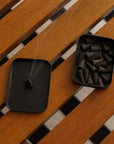 Light a cone to fill your space with smoky peppercorn, palo santo, and amber. 25 incense cones per tin for a warm, grounding aromatic experience.