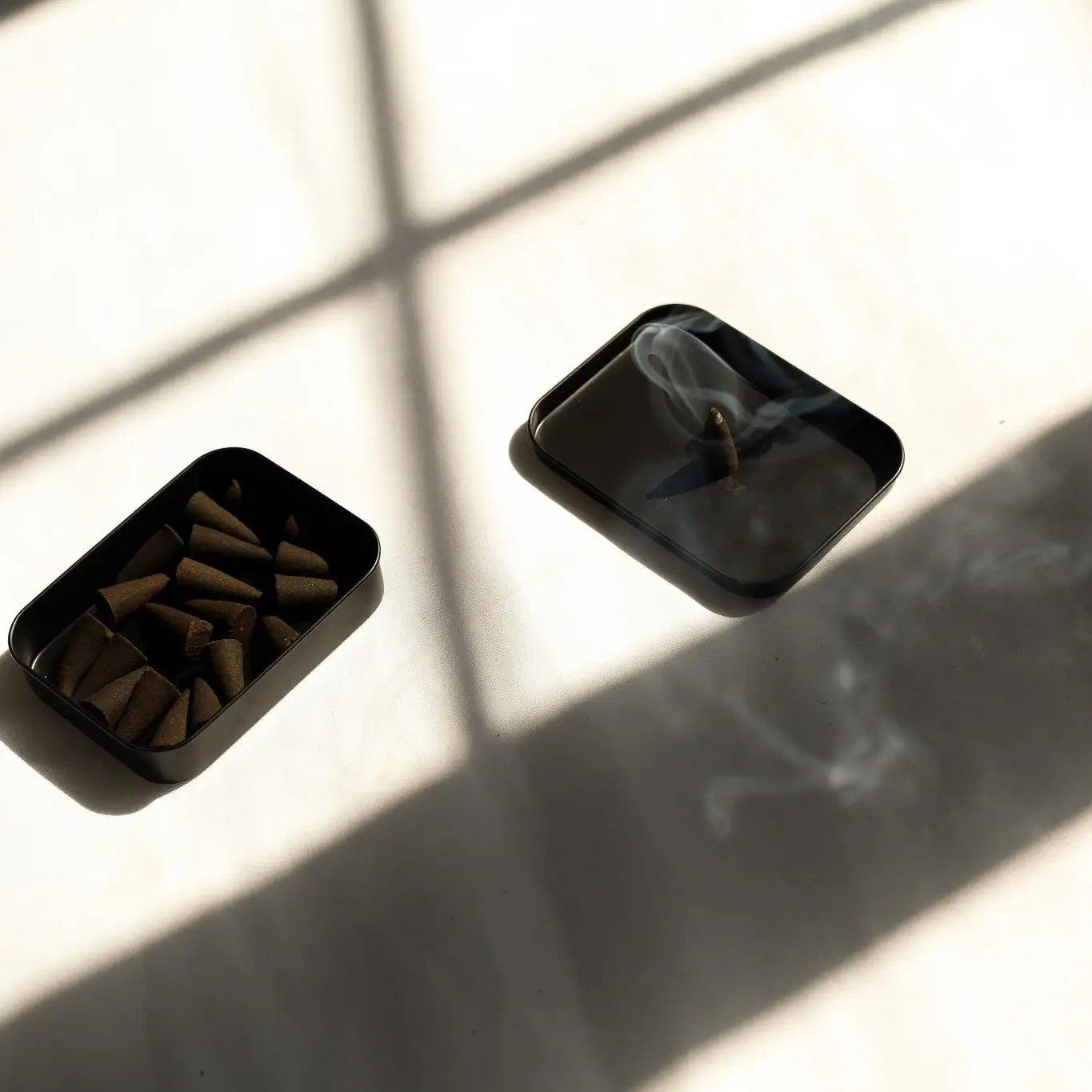 Light a cone to fill your space with smoky peppercorn, palo santo, and amber. 25 incense cones per tin for a warm, grounding aromatic experience.